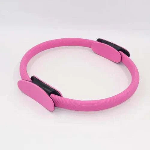 Pink Pilates Ring Magic Circle with dual grip and foam pads for yoga and fitness exercises.