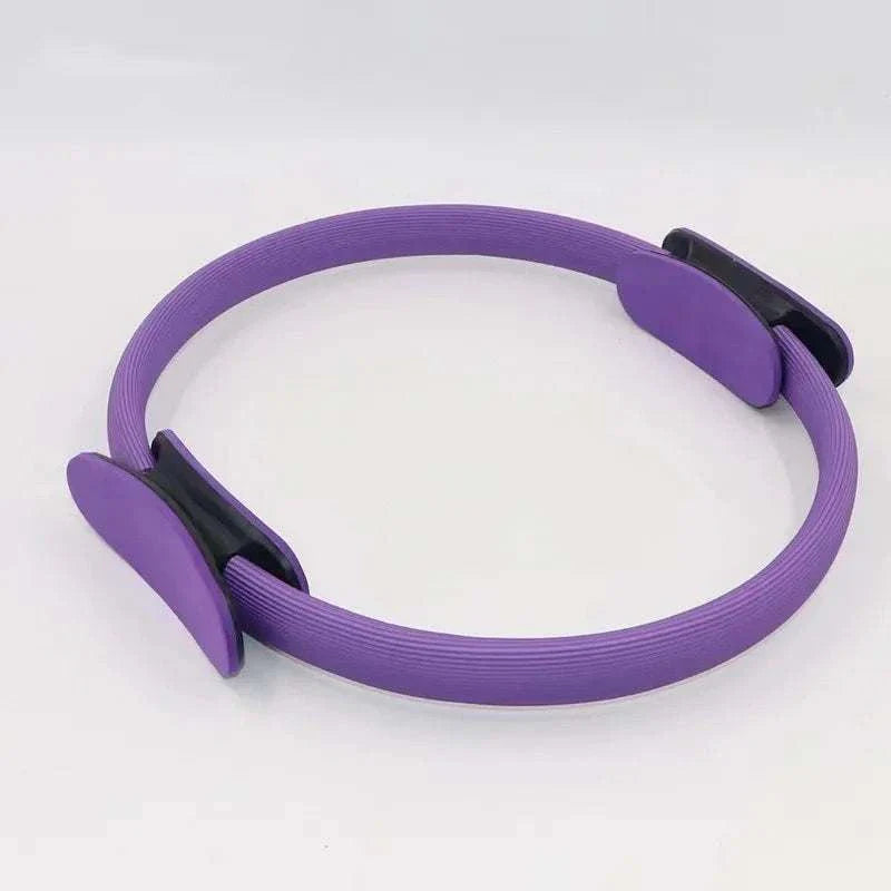 Purple Pilates Ring Magic Circle with dual grip foam pads for resistance training and toning exercises.