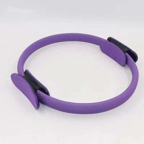 Purple 12" Pilates ring magic circle with dual grip and foam pads for fitness and toning exercises.