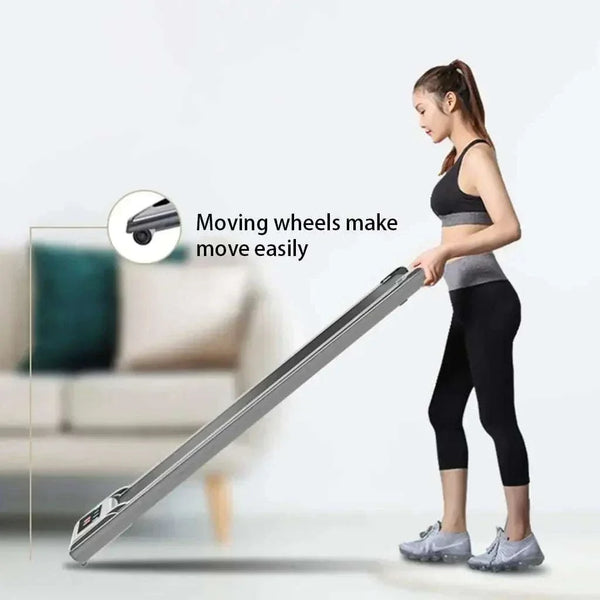 Woman moving a portable treadmill folding with ease using wheels in a home setting.